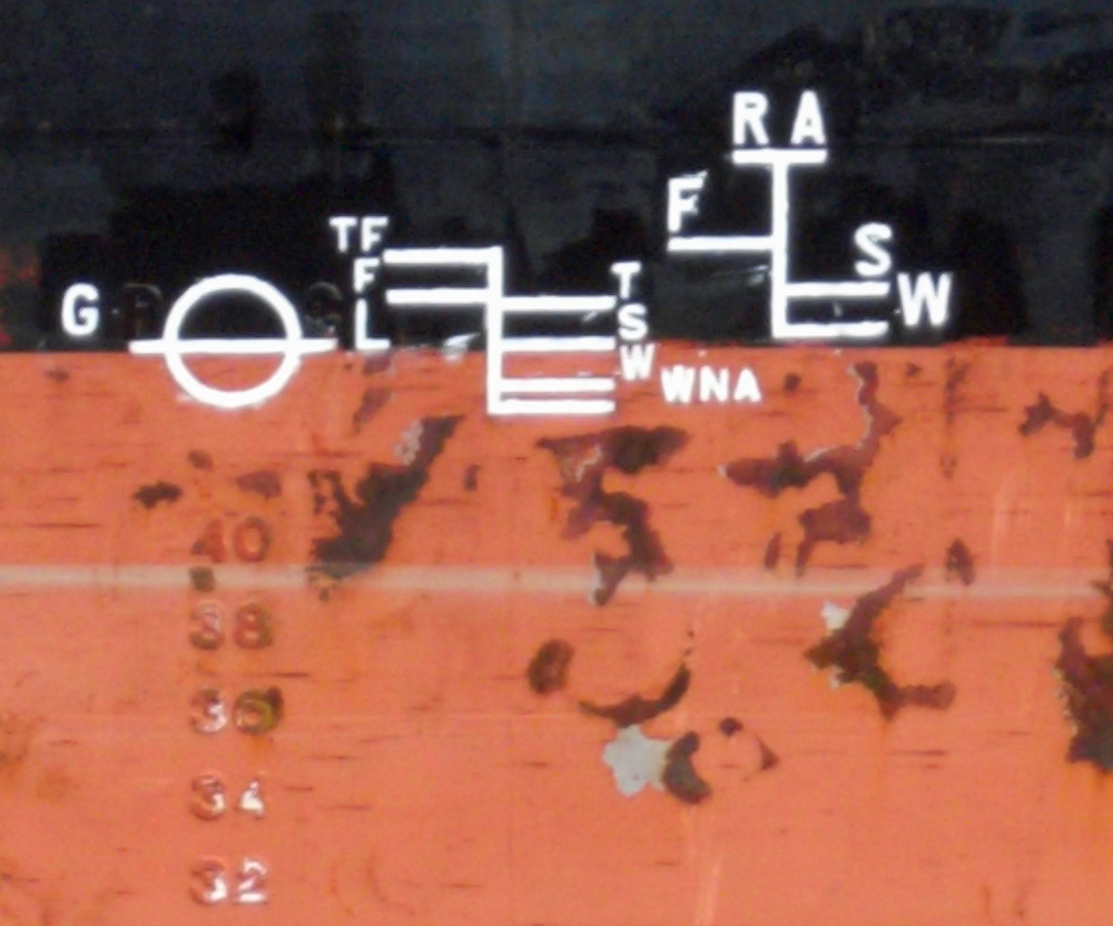The international load line and draught marks painted on a ship's hull